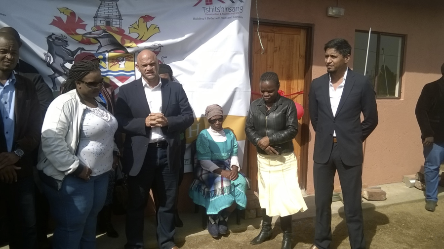 From the right, Mayor Cllr Afzul Rehman with the Manager in the Office of the Mayor, Ms Nomusa Mtshali and sitting down is Gogo Noboli Martha Nkambule who was handed over the house by Mayor Rehman. 