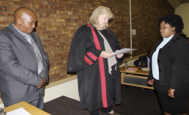 Cllr F.A Malinga swearing under oath in front of the Speaker and the magistrate
