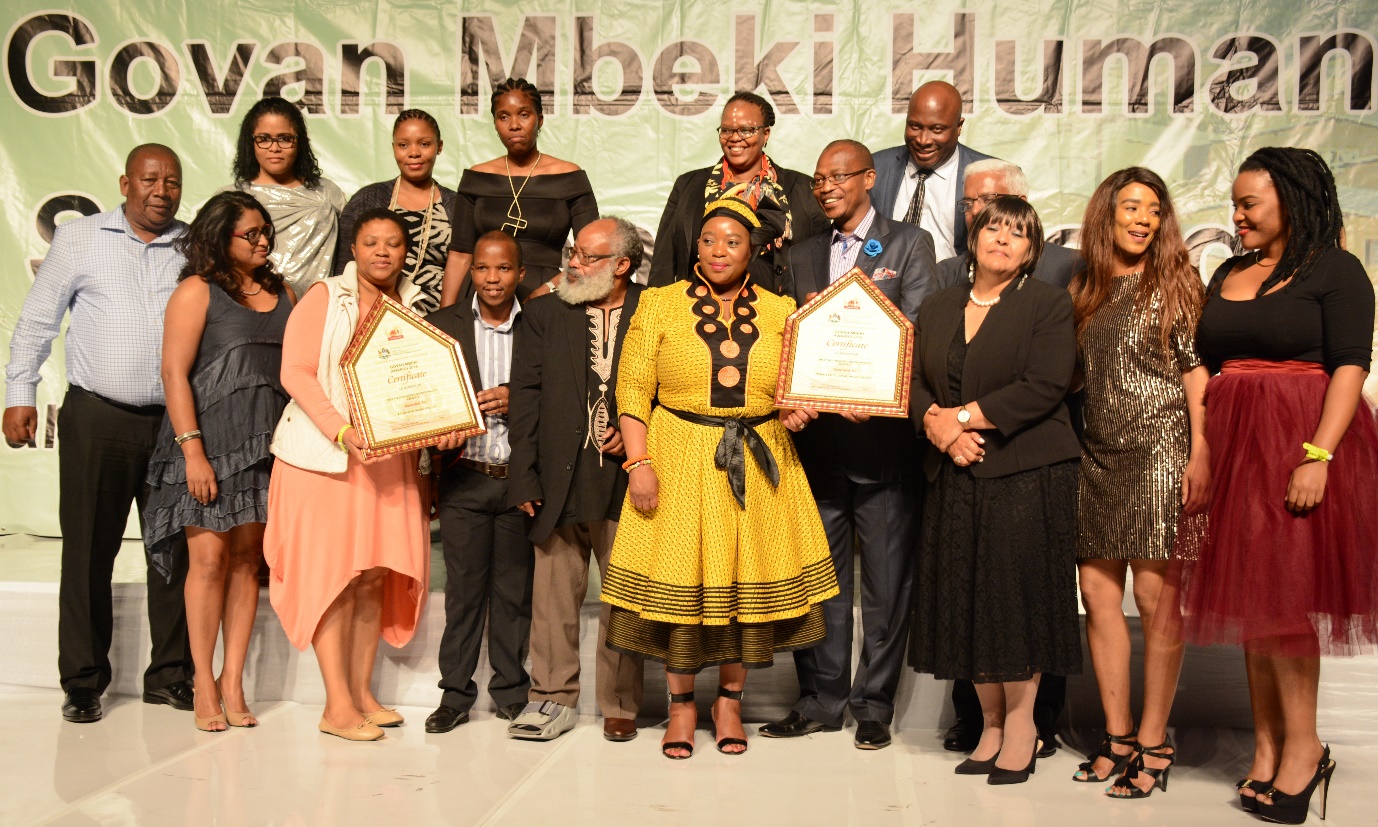 MEC Nomusa Dube- Ncube hands the award to Mayor Makhosini Nkosi